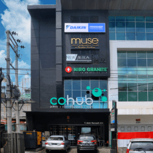 The Front Side of Cohub Indonesia Bulding with Cohub Indonesia, Niro Granite, New Mika, Muse Cabintery and Daikin Proshop Billboard